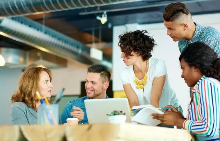 Business people in an animated brainstorming meeting
