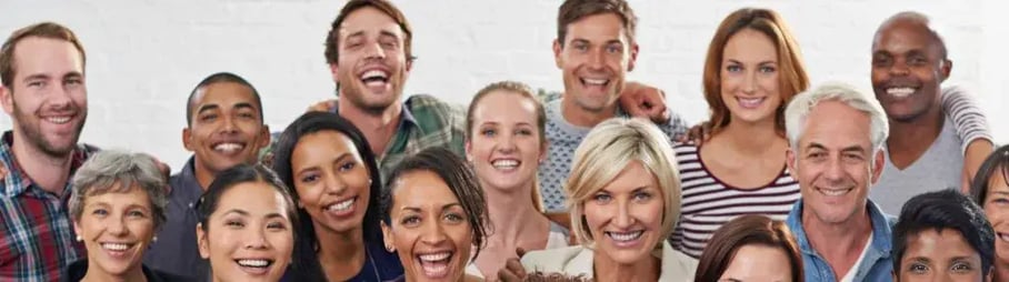 Numerous people smiling at the camera