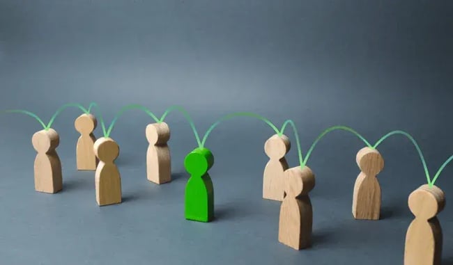 Teamwork wooden figures connection