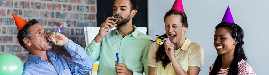 4 people celebrating in office
